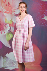 Side of model wearing the Annah Stretton Saski Angel Dress in pink check