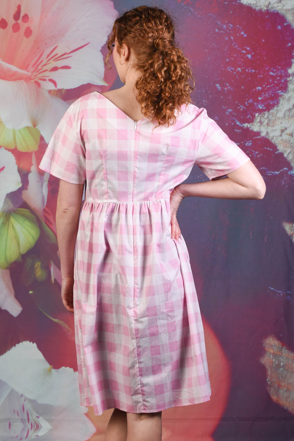 Back of model wearing the Annah Stretton Saski Angel Dress in pink check