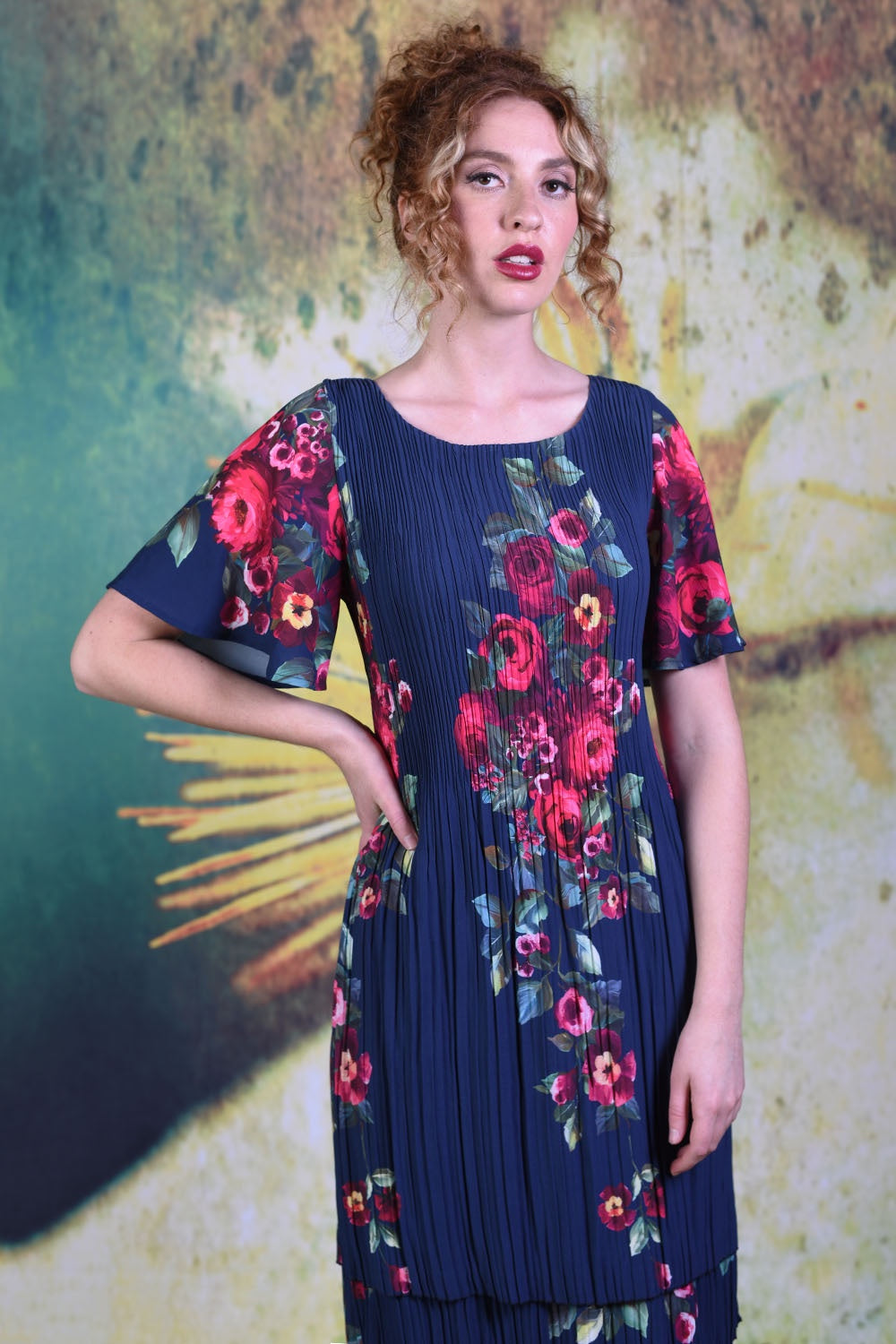 Model wearing the Annah Stretton Pleat Me Juliet Rose dress